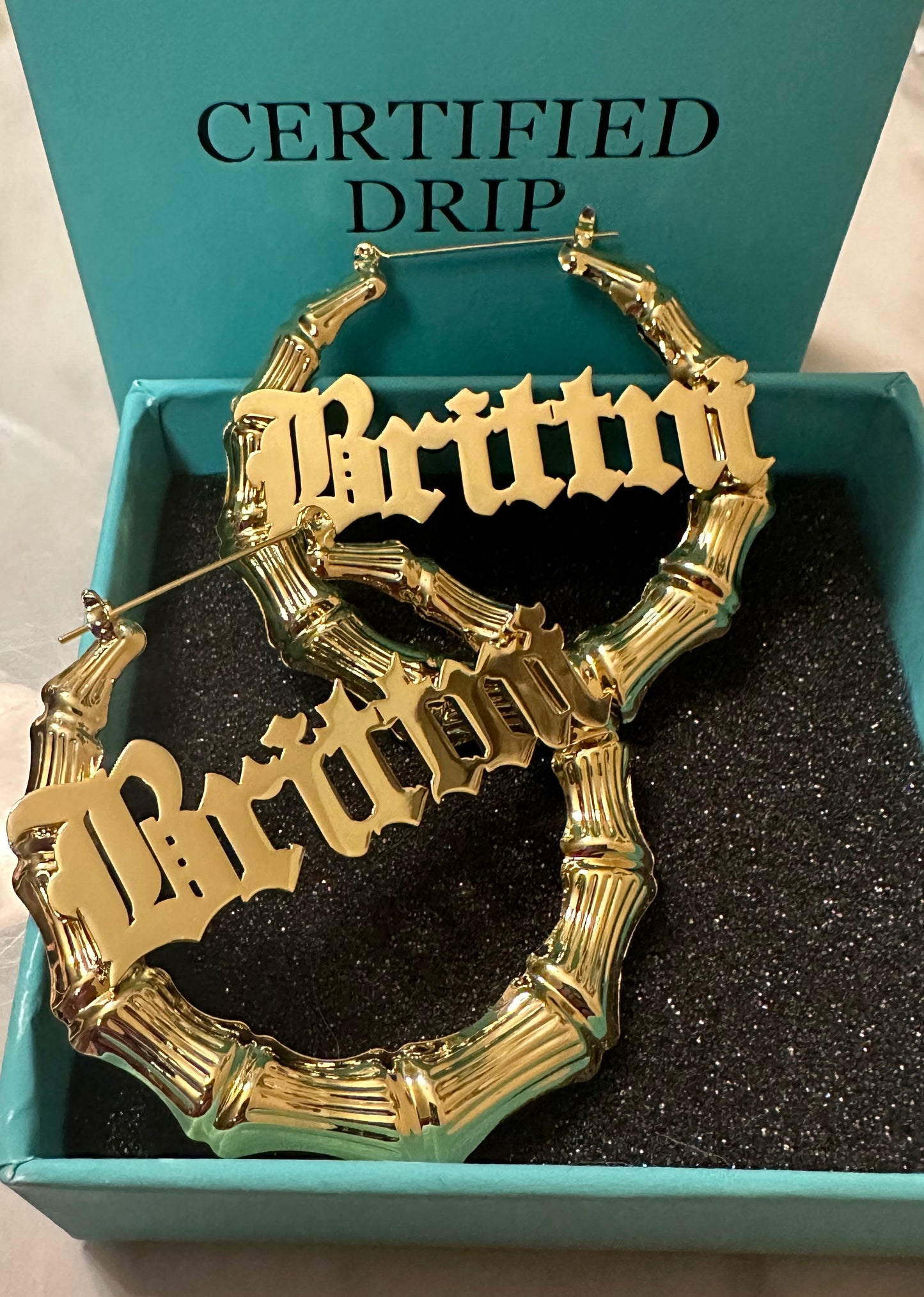 Picture of gold bamboo hoop earrings.