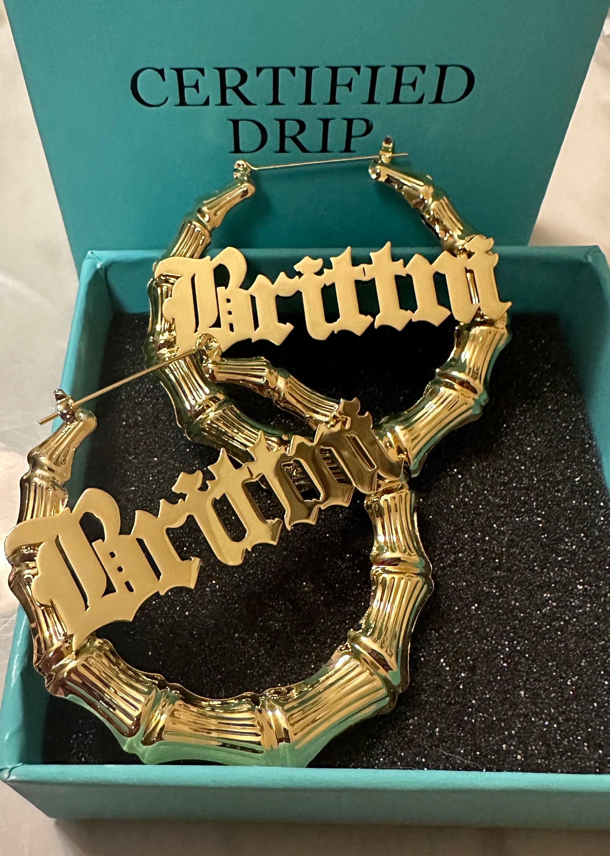 Picture of gold bamboo hoop earrings.